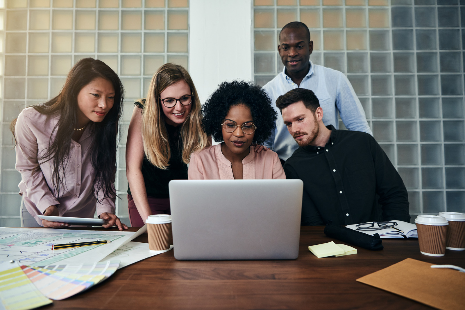 Canva Smiling Colleagues Working - UpCurve Cloud