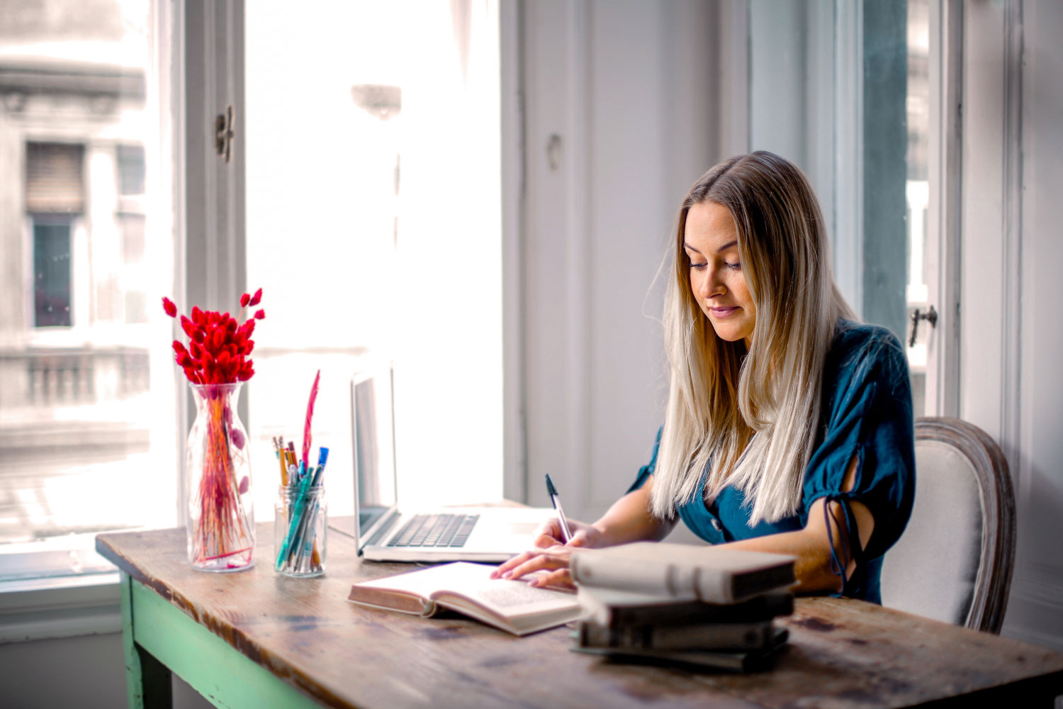 woman in blue long sleeve shirt sitting at the table working 3767388 - UpCurve Cloud